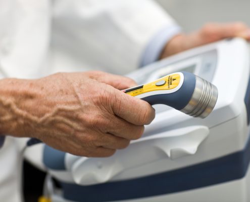Doctor Holding Laser Physical Therapy Wand