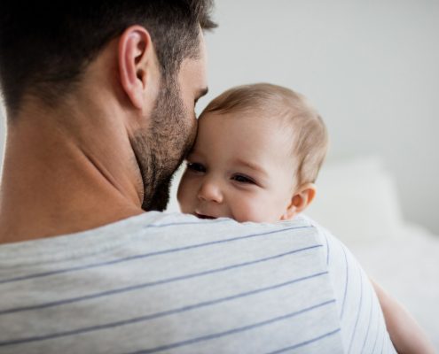 Father holding his baby girl